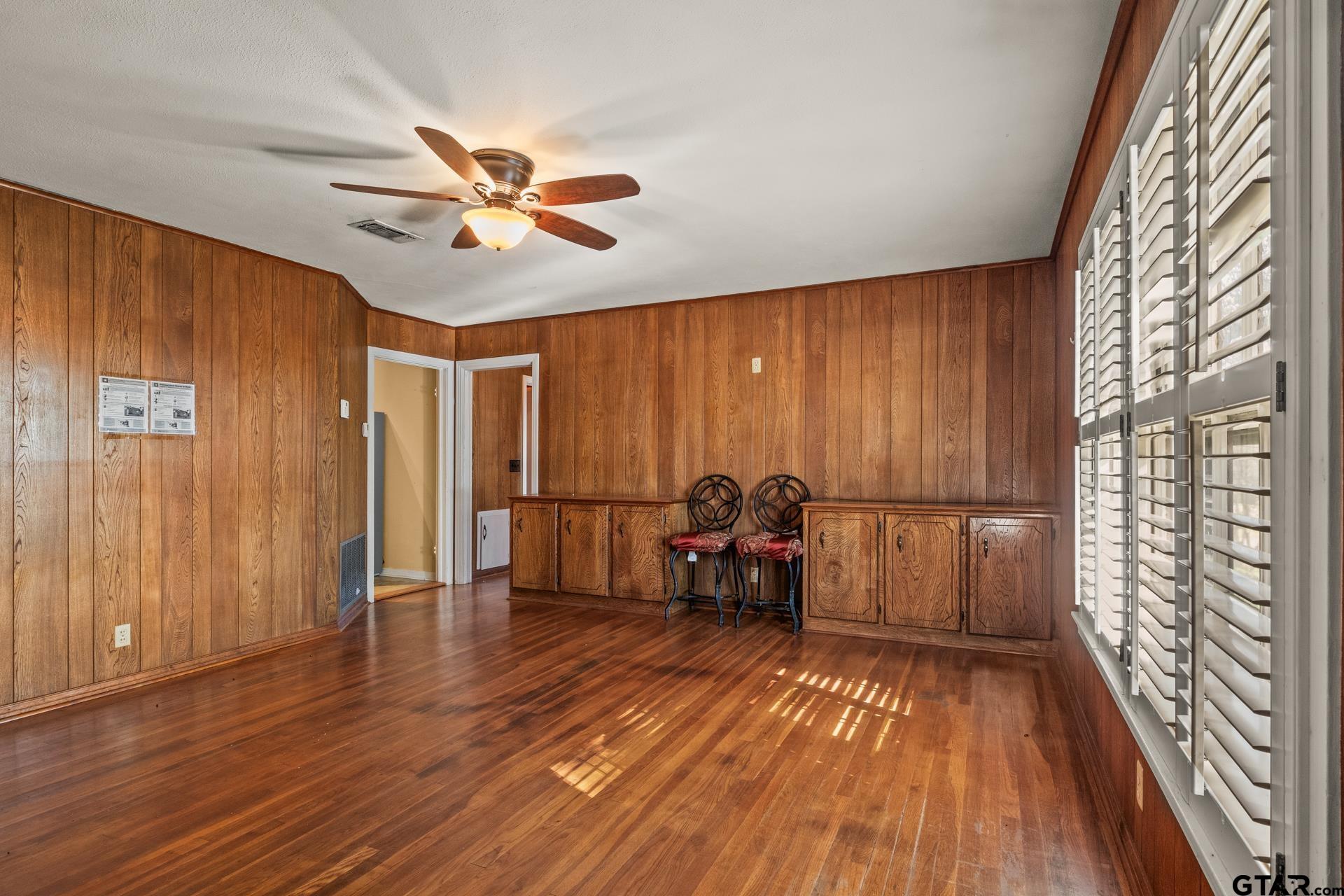 302 Smith Street Naples, TX 75568 - Photo 6 of 28 a view of a livingroom with furniture and hardwood floor