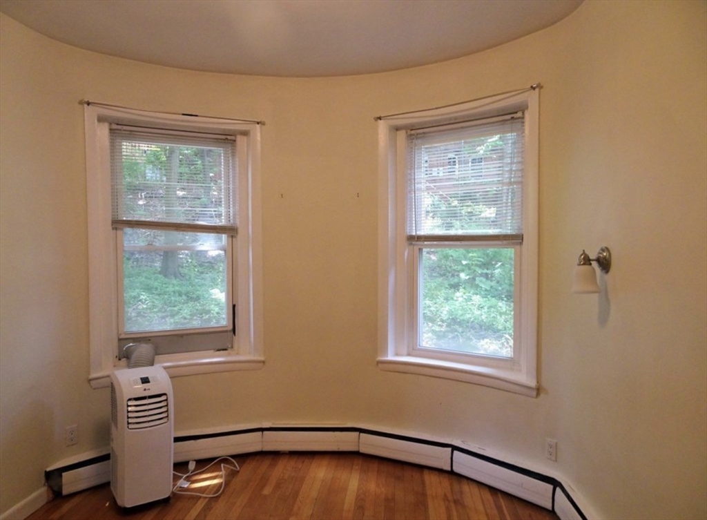 15 University, Unit 22 Brookline, MA 02445 - Photo 5 of 10 a view of an empty room with a window