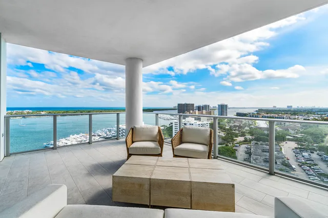 a bedroom with a large bed and a large window