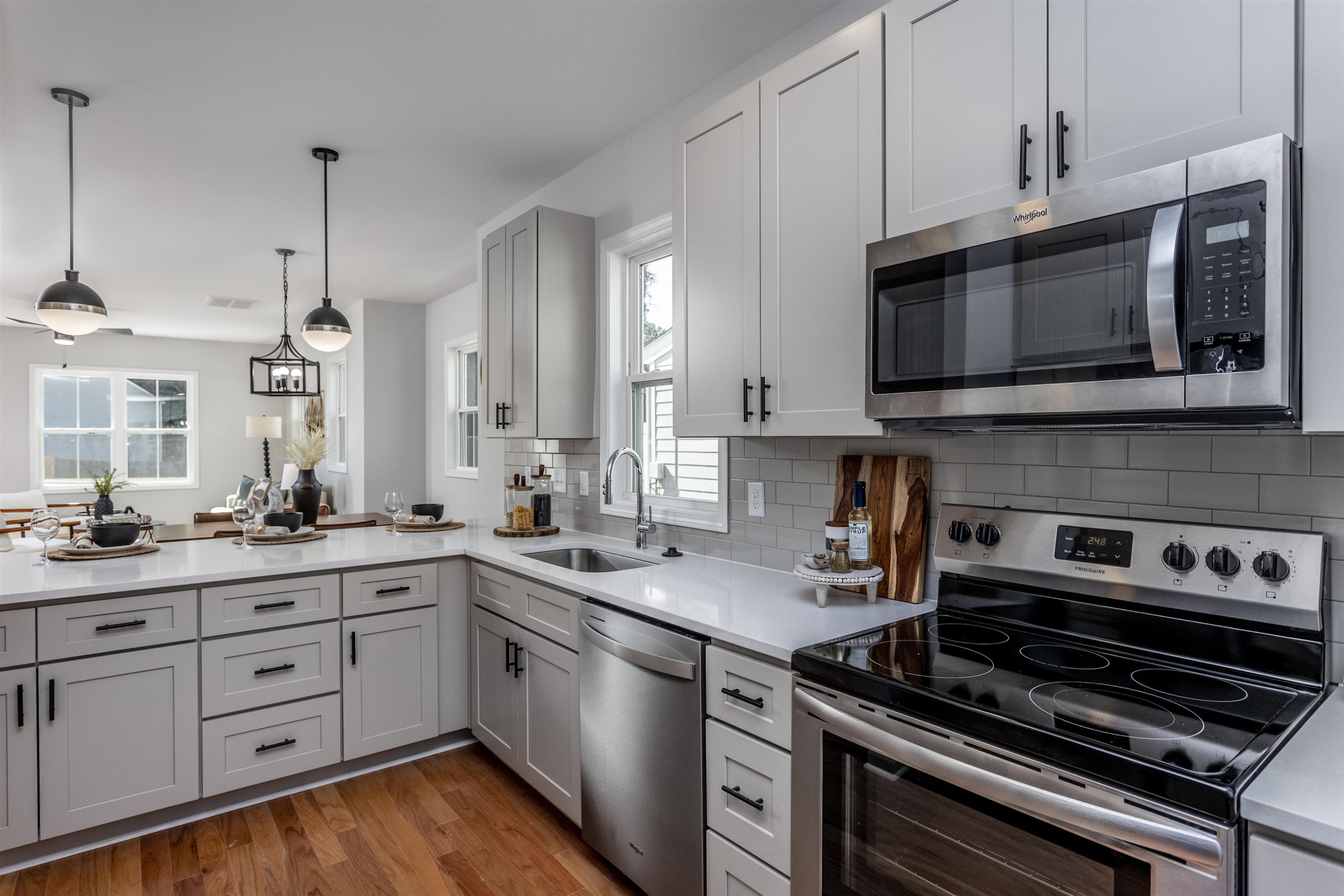 630 Rush Street Raleigh, NC 27610 - Photo 8 of 26 a kitchen with a stove and a microwave