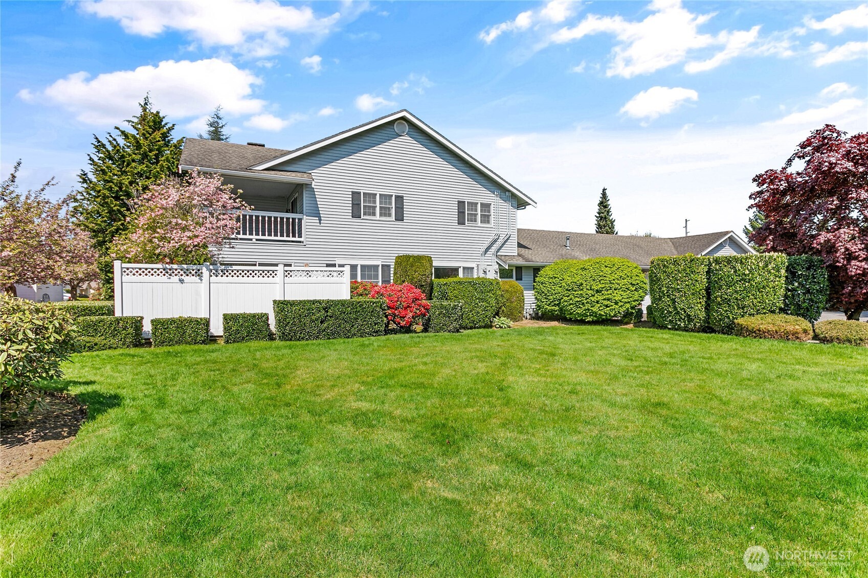 1843 Main Street, Unit A1 Lynden, WA 98264 - Photo 1 of 37 a front view of a house with a yard and garage