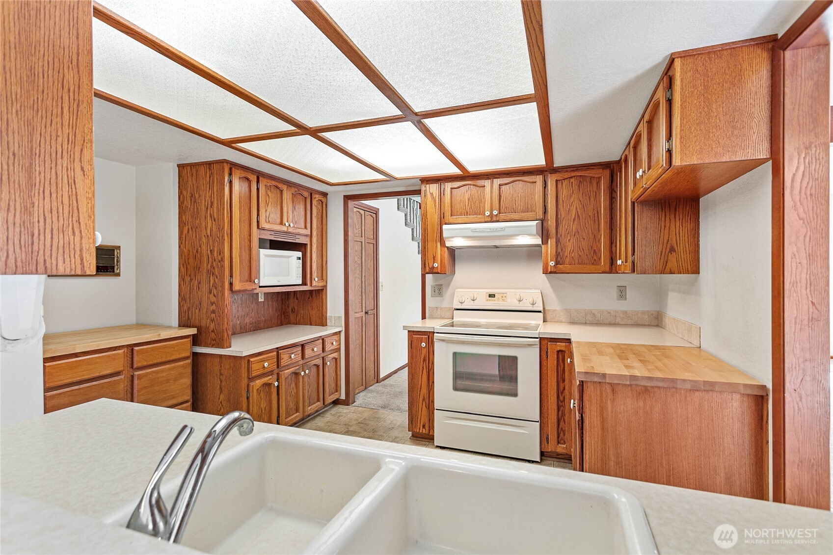 1843 Main Street, Unit A1 Lynden, WA 98264 - Photo 12 of 37 a kitchen with stainless steel appliances granite countertop a sink and cabinets