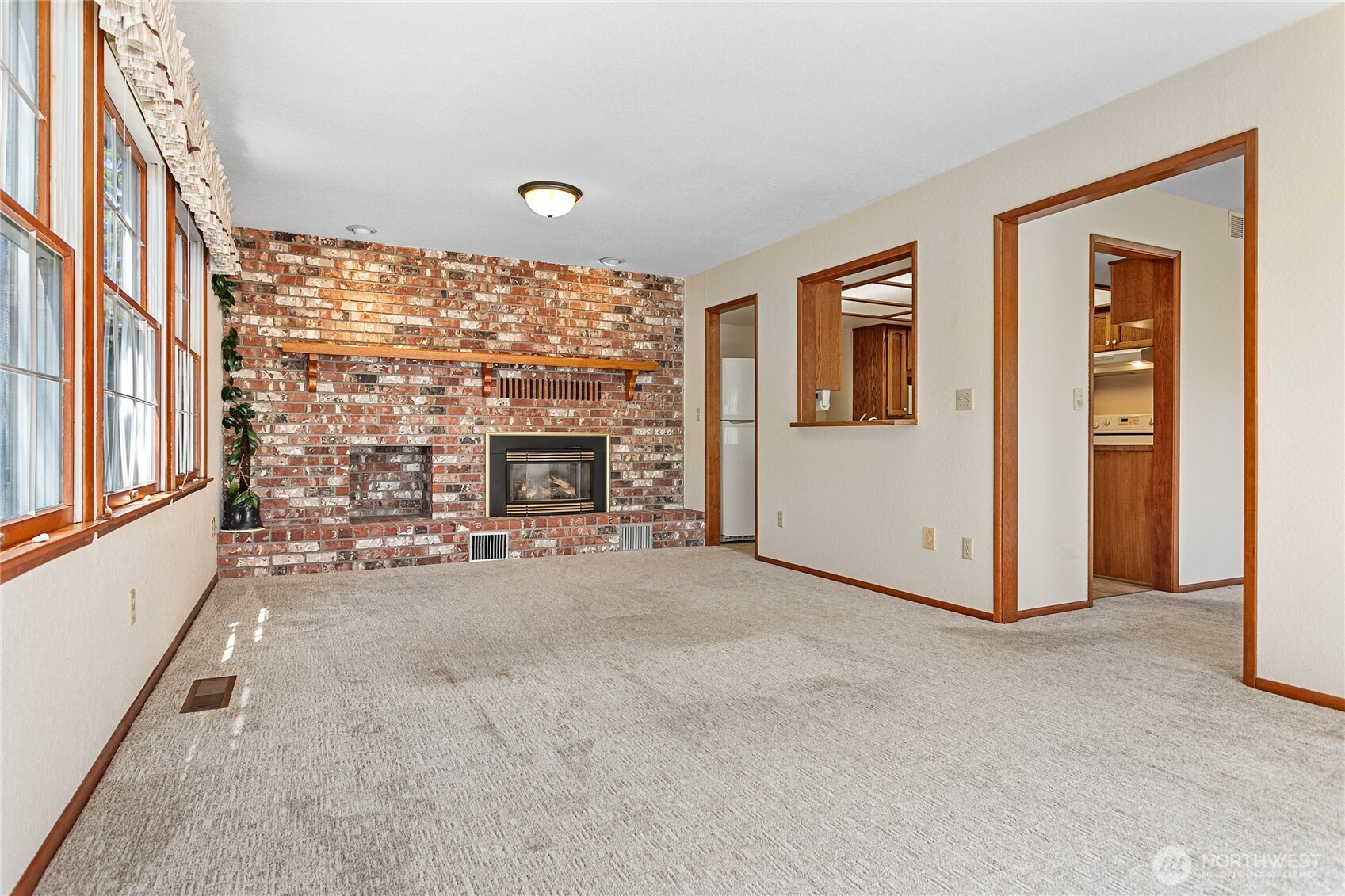 1843 Main Street, Unit A1 Lynden, WA 98264 - Photo 16 of 37 a view of an empty room with fireplace and a window