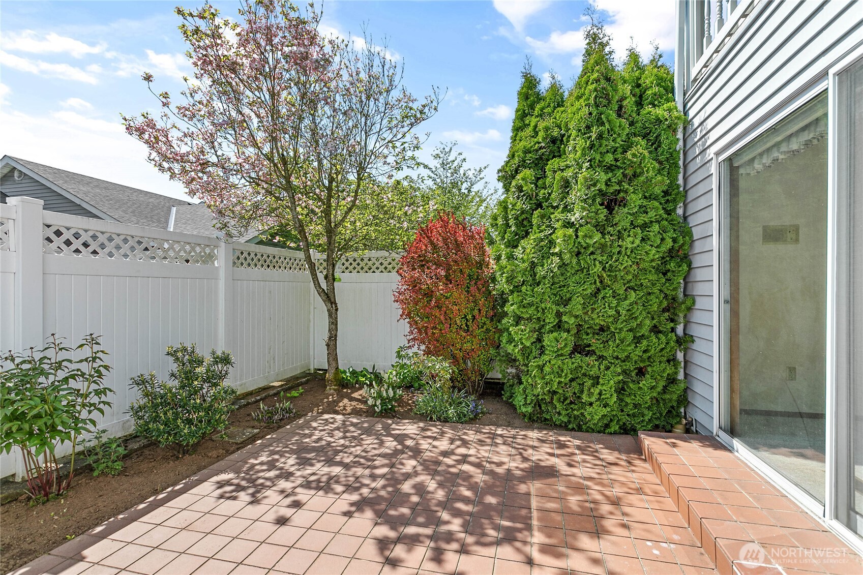 1843 Main Street, Unit A1 Lynden, WA 98264 - Photo 18 of 37 a backyard of a house with lots of green space