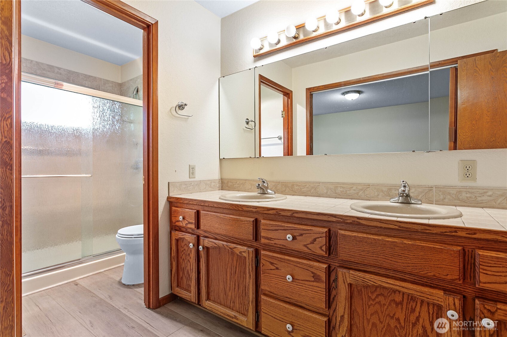 1843 Main Street, Unit A1 Lynden, WA 98264 - Photo 22 of 37 a bathroom with a granite countertop sink toilet and shower