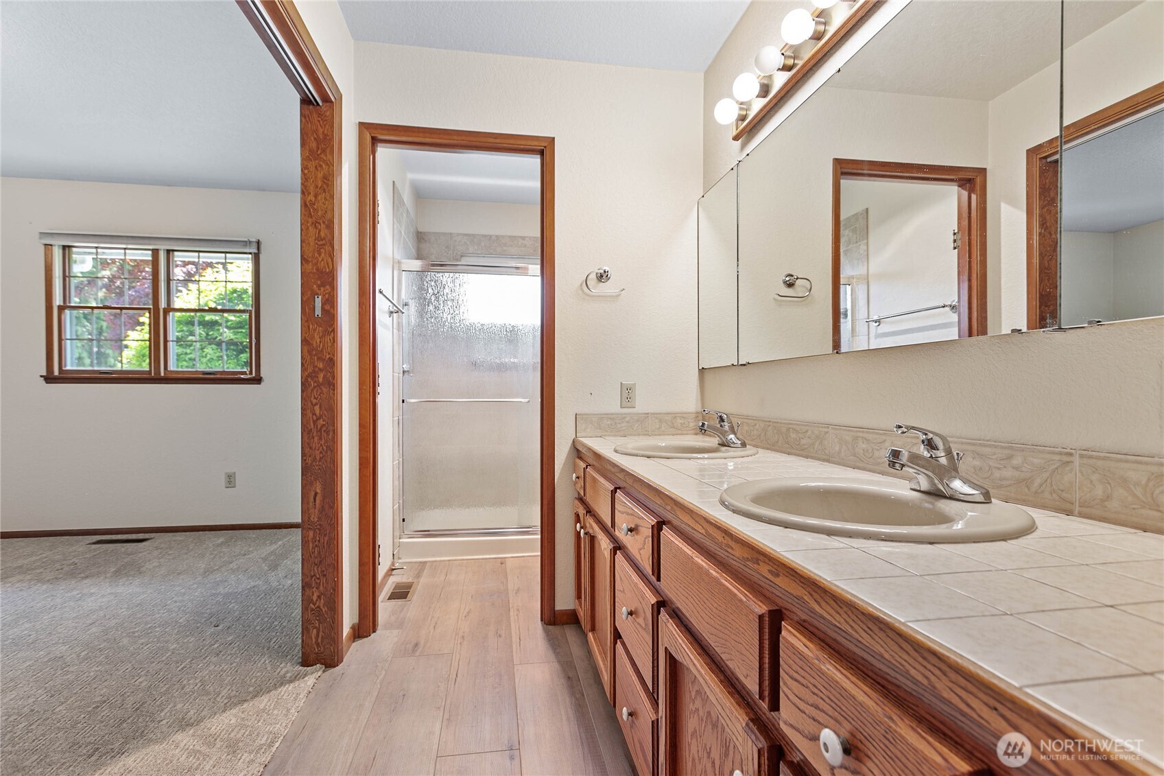 1843 Main Street, Unit A1 Lynden, WA 98264 - Photo 23 of 37 a bathroom with a granite countertop sink and a mirror