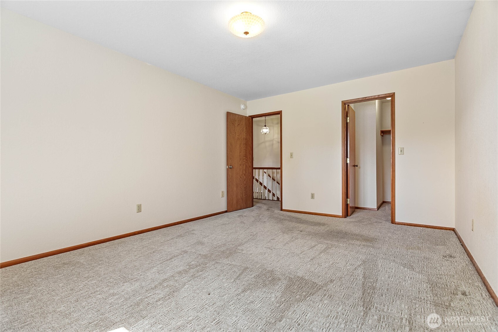 1843 Main Street, Unit A1 Lynden, WA 98264 - Photo 30 of 37 an empty room with closet and mirror