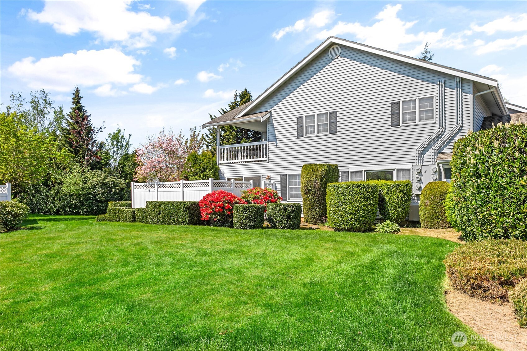 1843 Main Street, Unit A1 Lynden, WA 98264 - Photo 35 of 37 a view of a house with a yard and plants