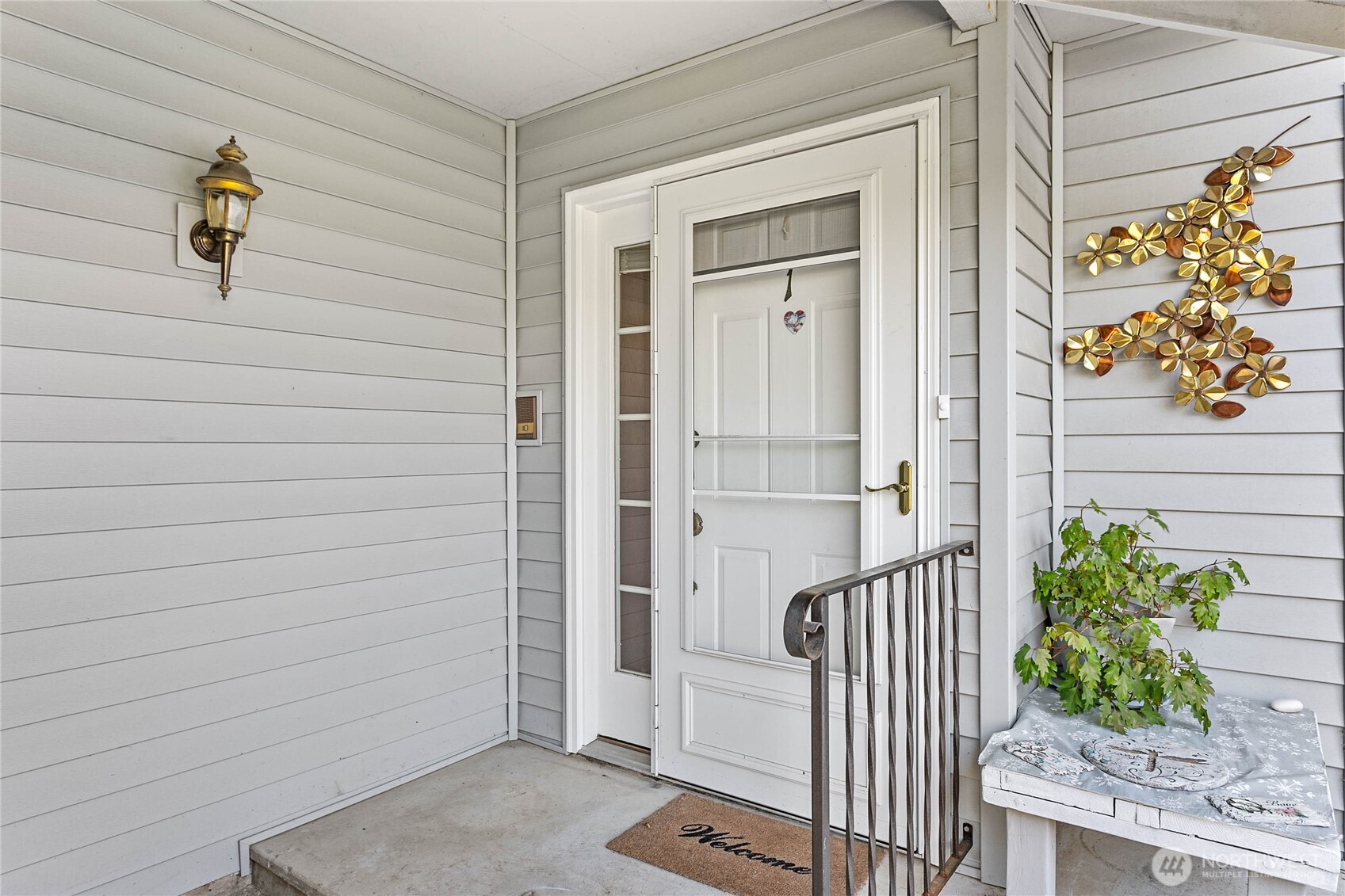 1843 Main Street, Unit A1 Lynden, WA 98264 - Photo 4 of 37 a view of a porch with a bench
