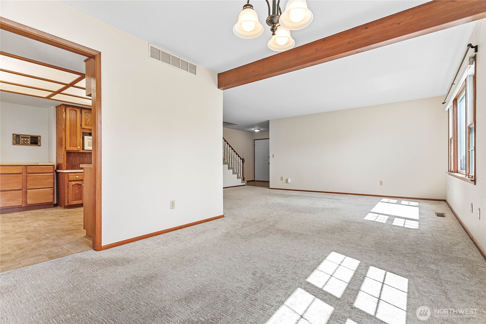 1843 Main Street, Unit A1 Lynden, WA 98264 - Photo 10 of 37 en empty room with windows and chandelier