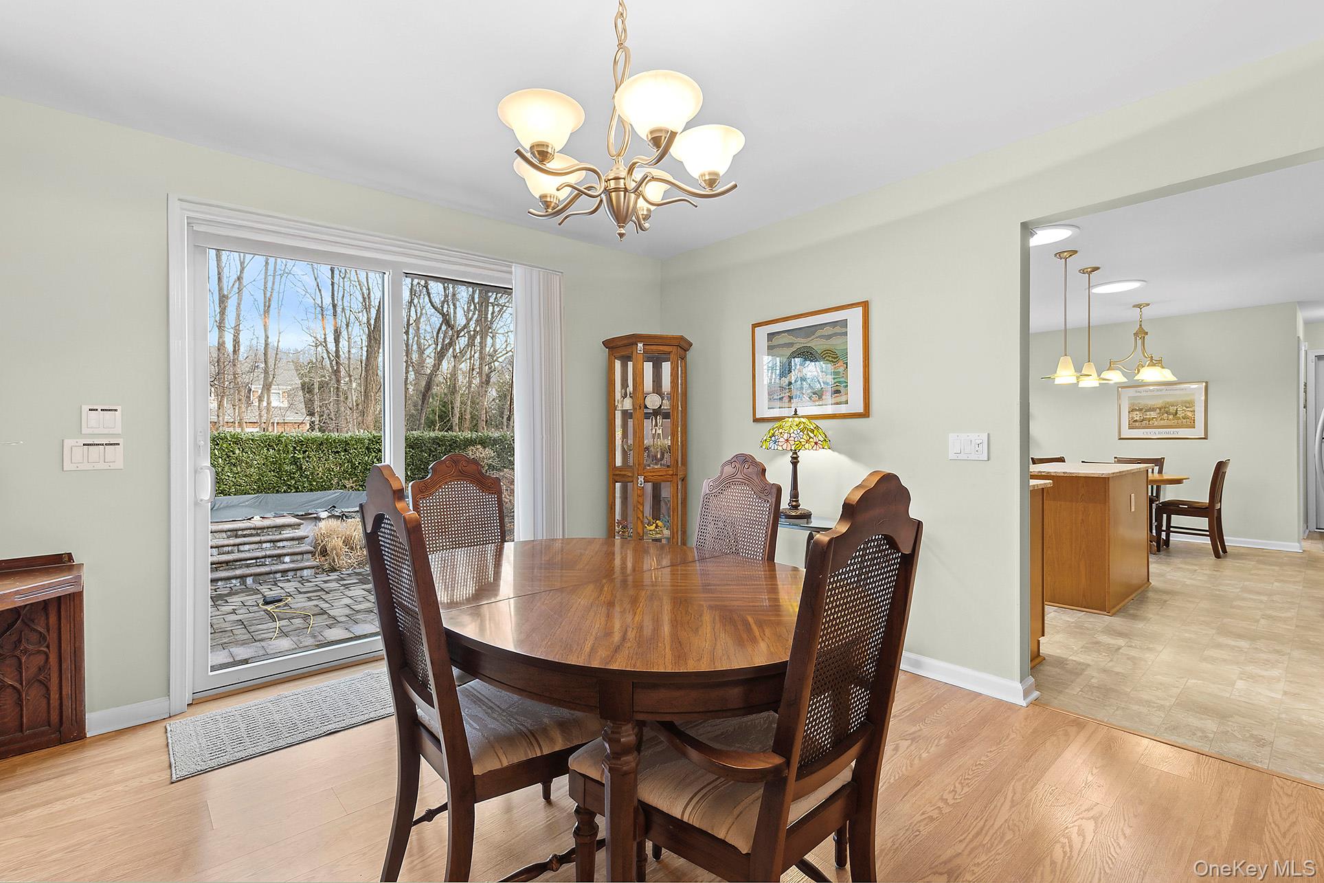 17 Cove View Road Sag Harbor, NY 11963 - Photo 6 of 15 Dining space with a chandelier and light wood-type flooring