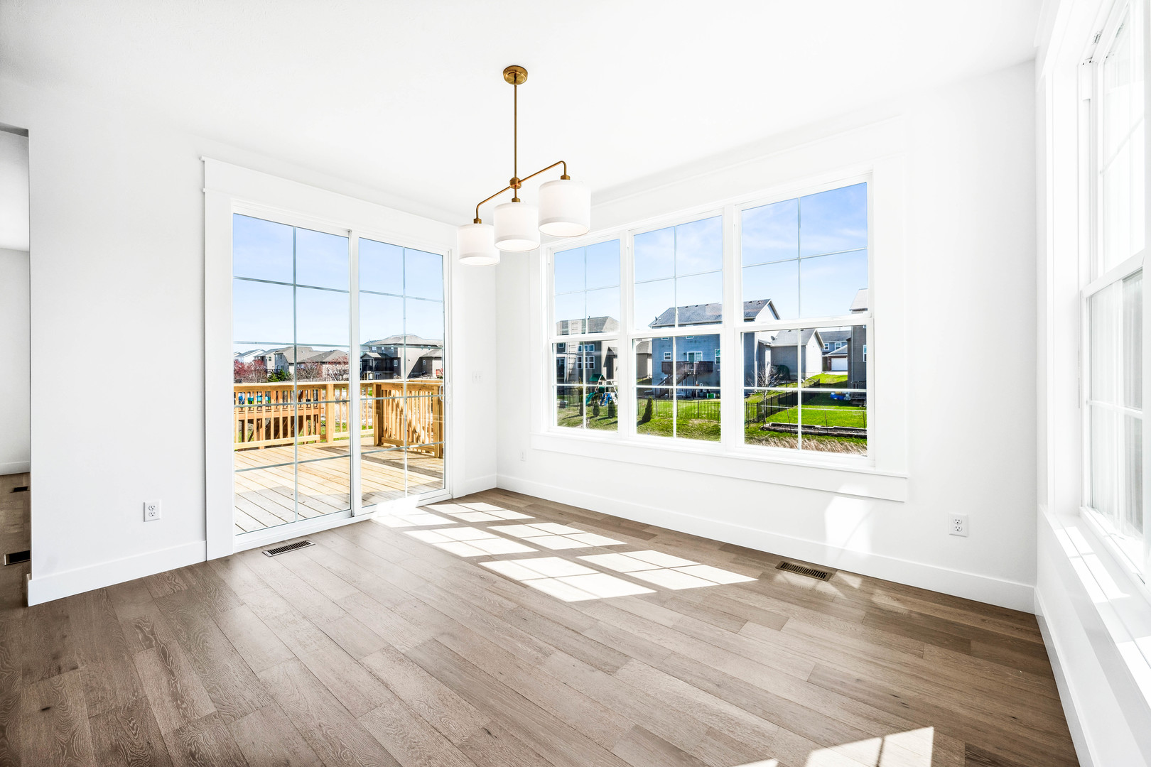 5017 Finlen Lane Bloomington, IL 61705 - Photo 23 of 60 a view of an empty room with a window and wooden floor