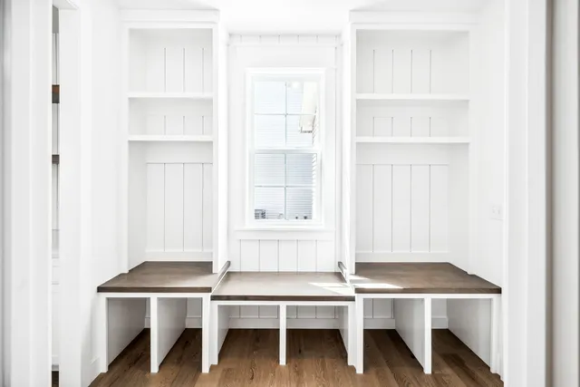 a view of a hallway with entryway door