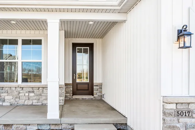 a front view of a house with a glass door