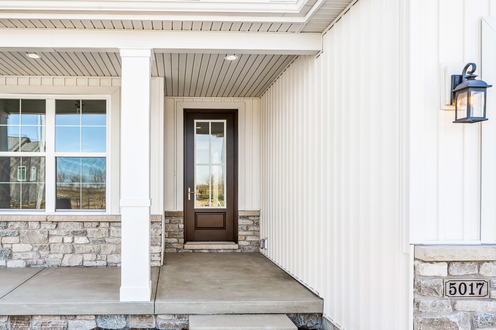 5017 Finlen Lane Bloomington, IL 61705 - Photo 3 of 60 a front view of a house with a glass door