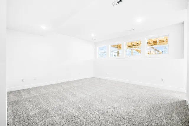 a front view of a house with a garden and porch