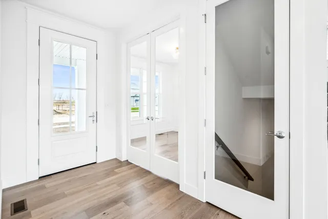 a view of a room with wooden floor
