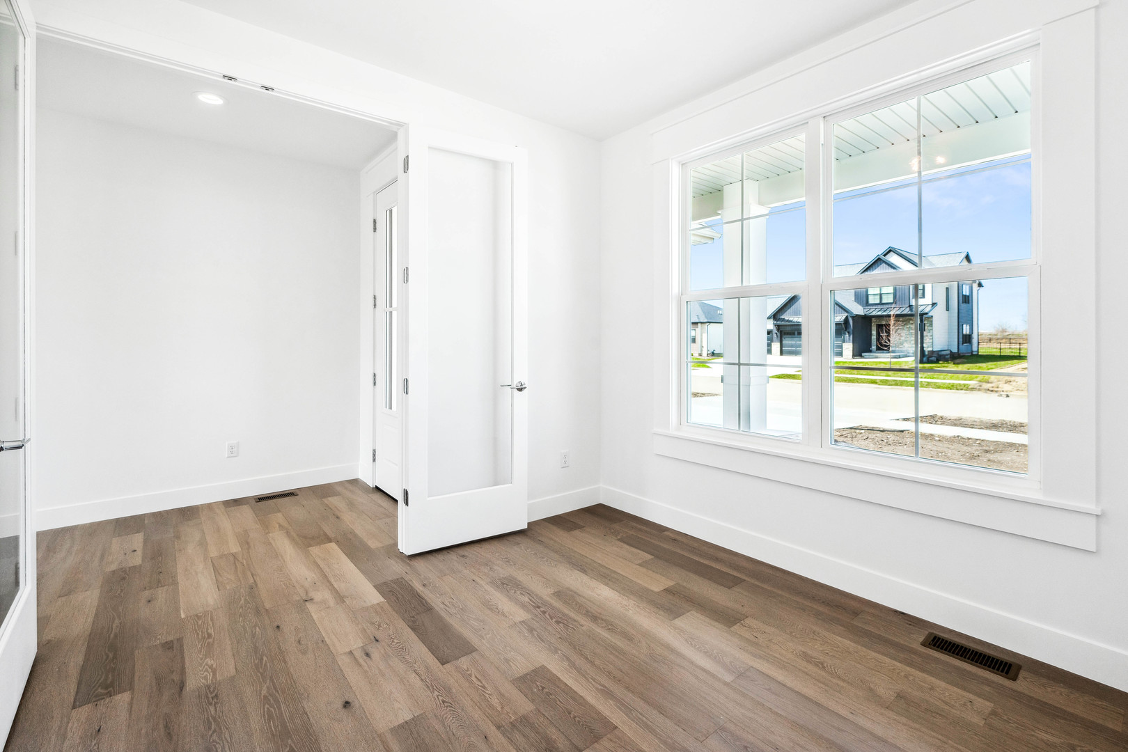 5017 Finlen Lane Bloomington, IL 61705 - Photo 7 of 60 a view of wooden floor and windows in a room
