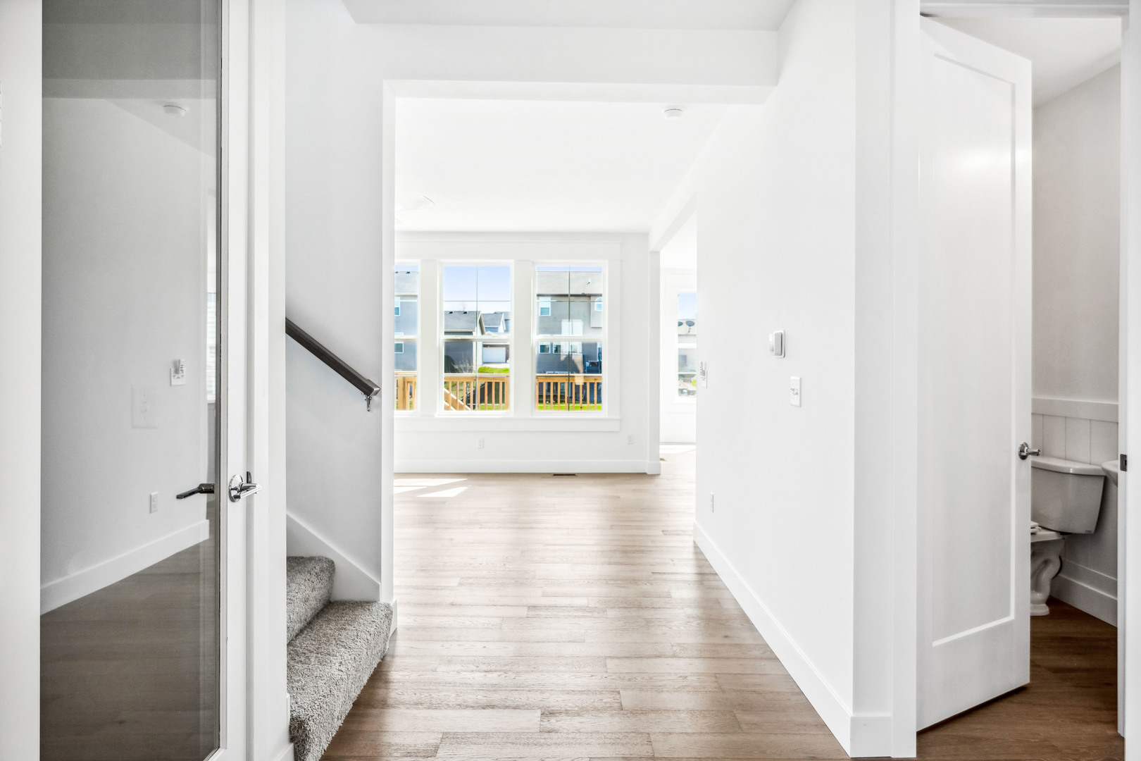 5017 Finlen Lane Bloomington, IL 61705 - Photo 9 of 60 a view of a hallway with wooden floor and staircase