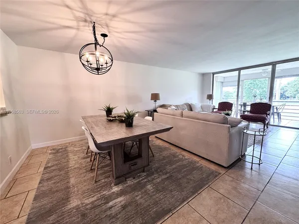 a living room with a table and a window