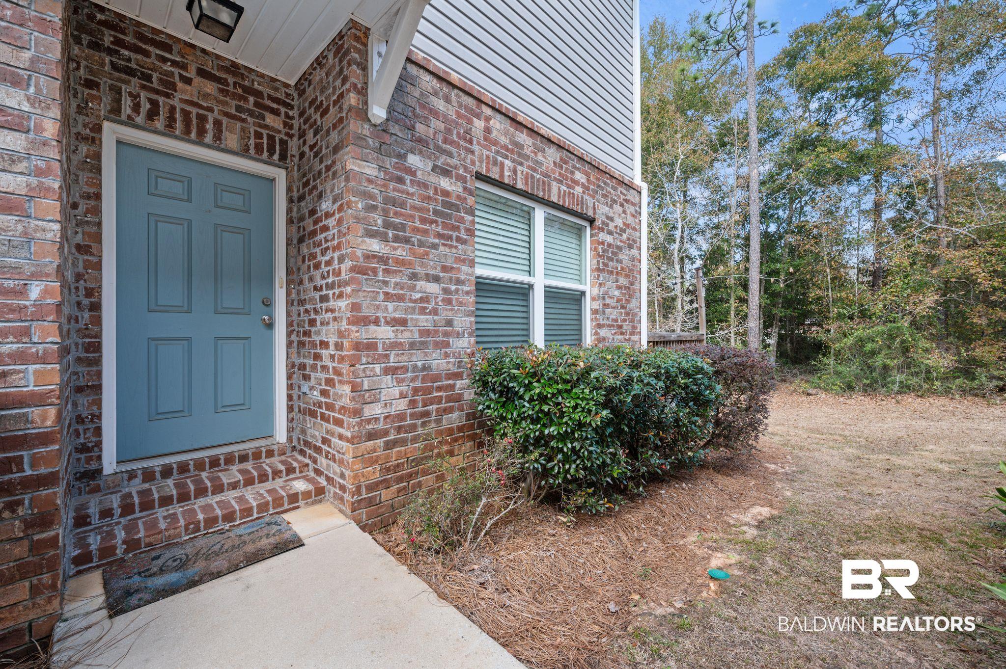 6903 Spaniel Drive, Unit B Spanish Fort, AL 36527 - Photo 3 of 28 Entrance to property featuring brick siding