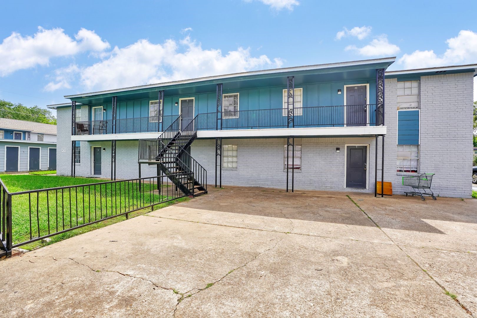 427 Hollyvale Drive, Unit 24 Houston, TX 77060 - Photo 9 of 9 a front view of a house with a garden and garage