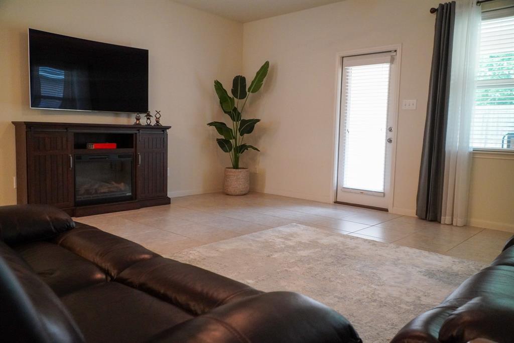 13624 Helix Bridge Way Crowley, TX 76036 - Photo 6 of 25 a view of livingroom with furniture and a fireplace