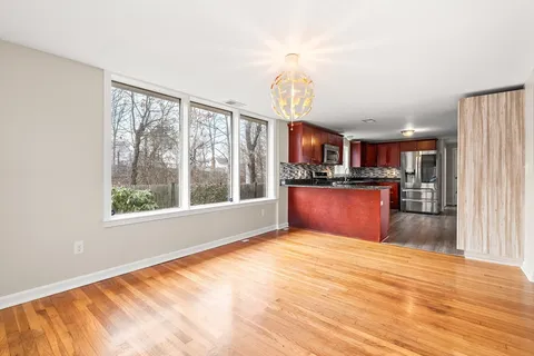 a view of kitchen and wooden floor