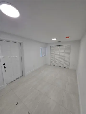 an empty room with a natural light