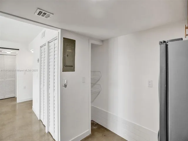 a kitchen with a stove top oven sink and cabinets