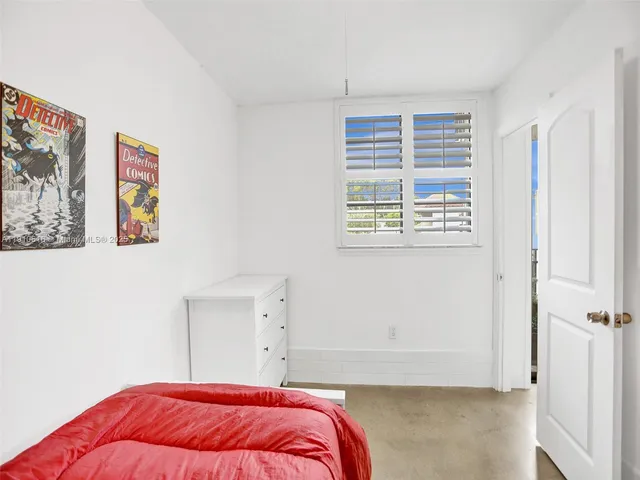 a bedroom with a workspace