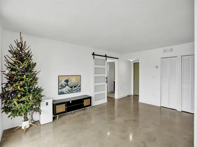 a view of an empty room and workspace
