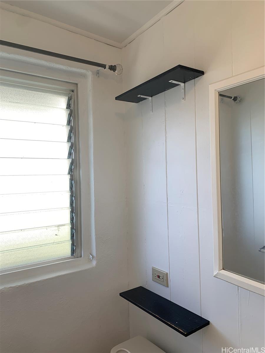 3121 Paliuli Street, Unit D Honolulu, HI 96816 - Photo 11 of 12 a room with a window and a table