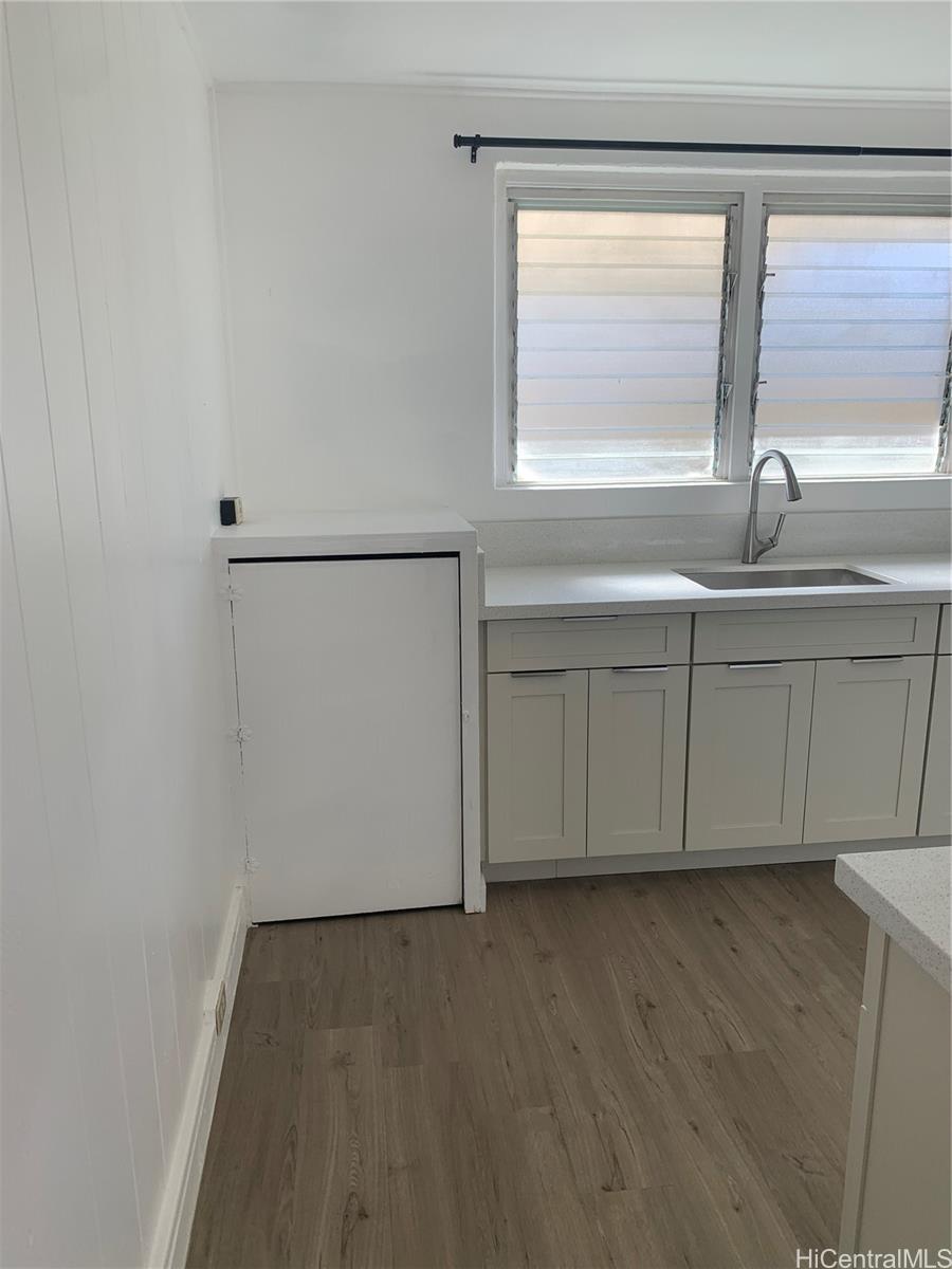 3121 Paliuli Street, Unit D Honolulu, HI 96816 - Photo 2 of 12 a view of kitchen with wooden floor and window