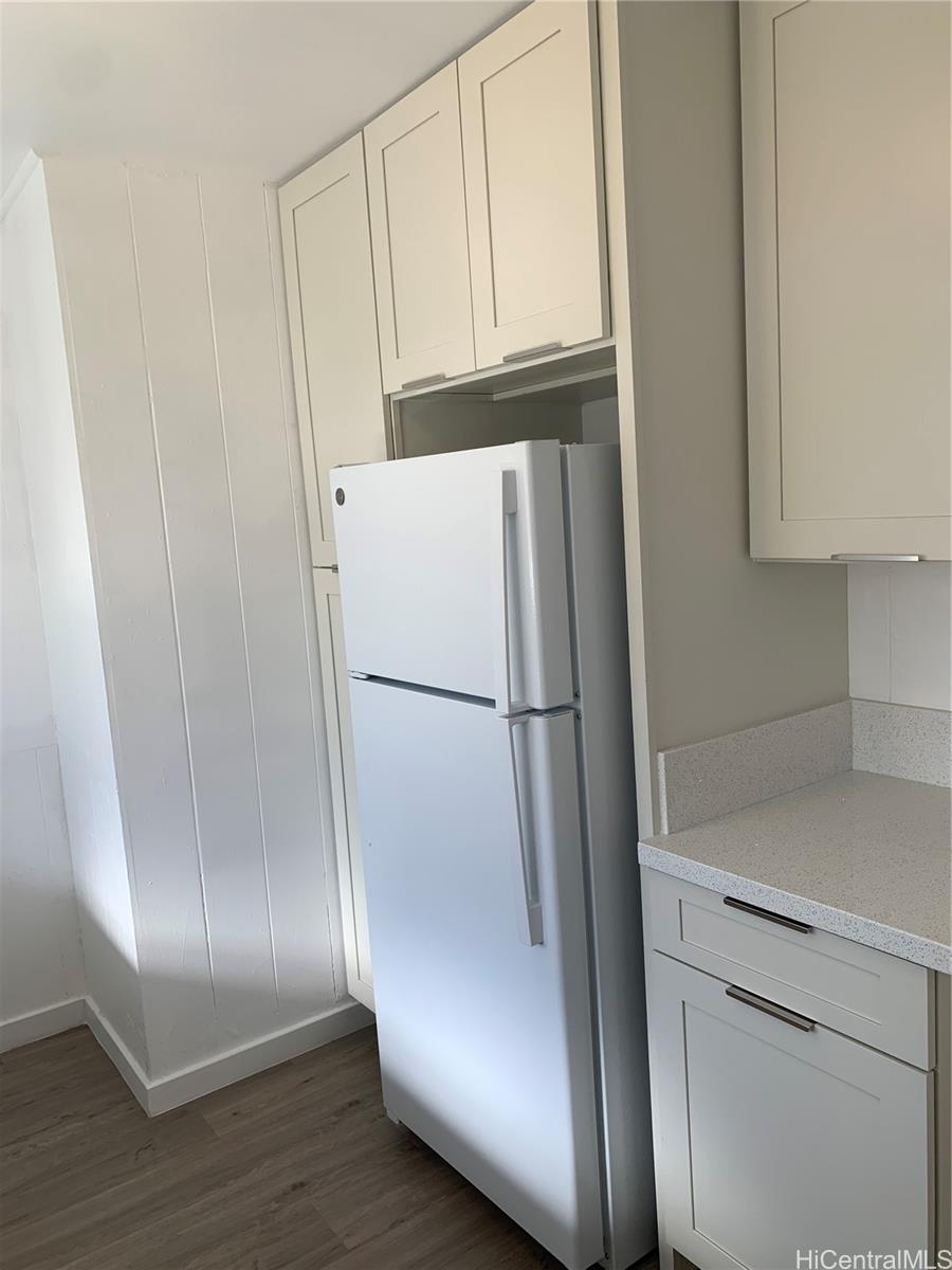 3121 Paliuli Street, Unit D Honolulu, HI 96816 - Photo 3 of 12 a white refrigerator freezer and a stove sitting inside of a kitchen