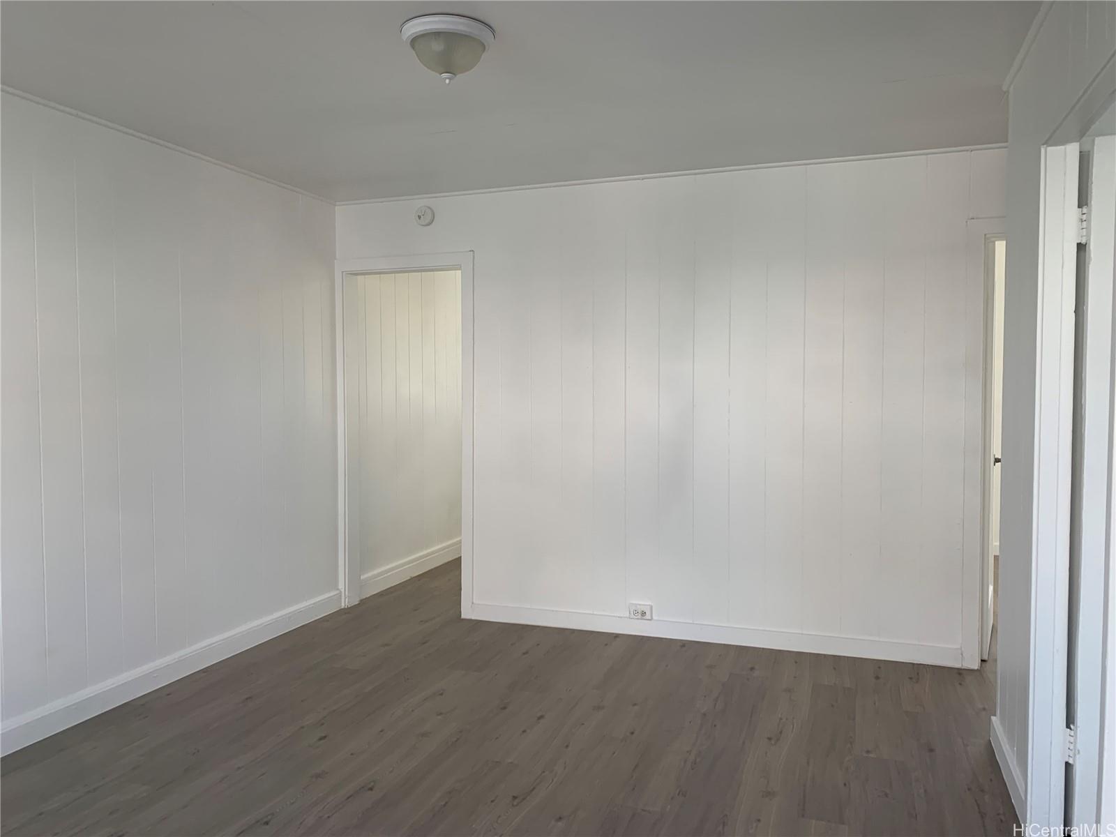 3121 Paliuli Street, Unit D Honolulu, HI 96816 - Photo 6 of 12 an empty room with wooden floor
