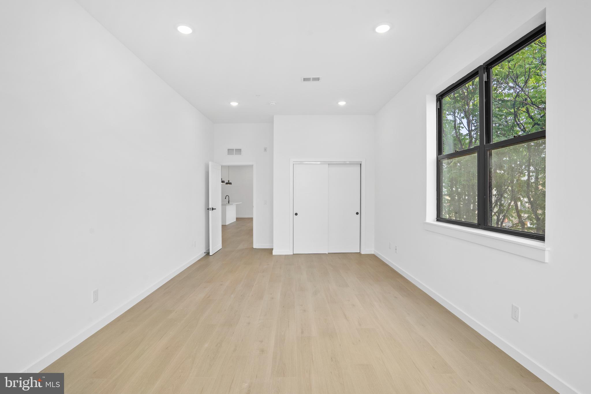 3211 Cedar Street, Unit 402 Philadelphia, PA 19134 - Photo 8 of 21 a view of an empty room with a window