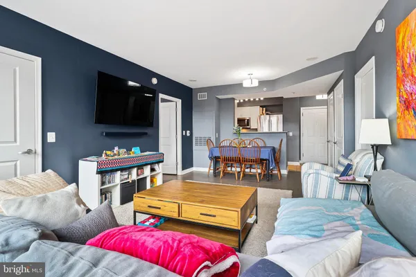 a bedroom with furniture and a flat screen tv