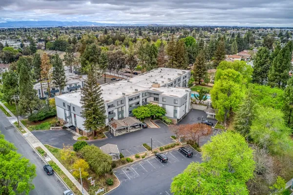 an aerial view of a house with a garden