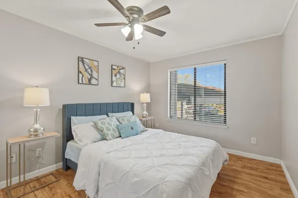 a bedroom with a large bed and a window