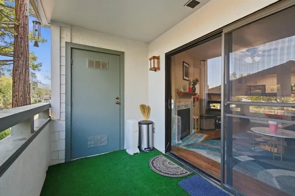 a view of a living room with a floor to ceiling window and a street
