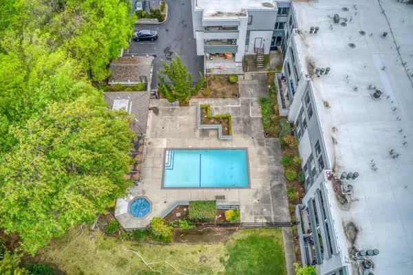 an aerial view of a house with a yard and lake view