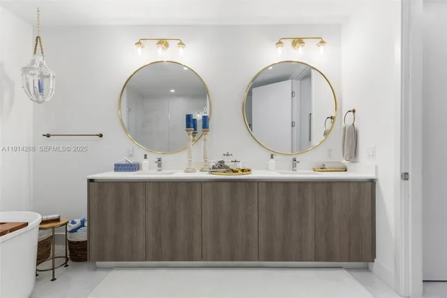a bathroom with mirror and sink