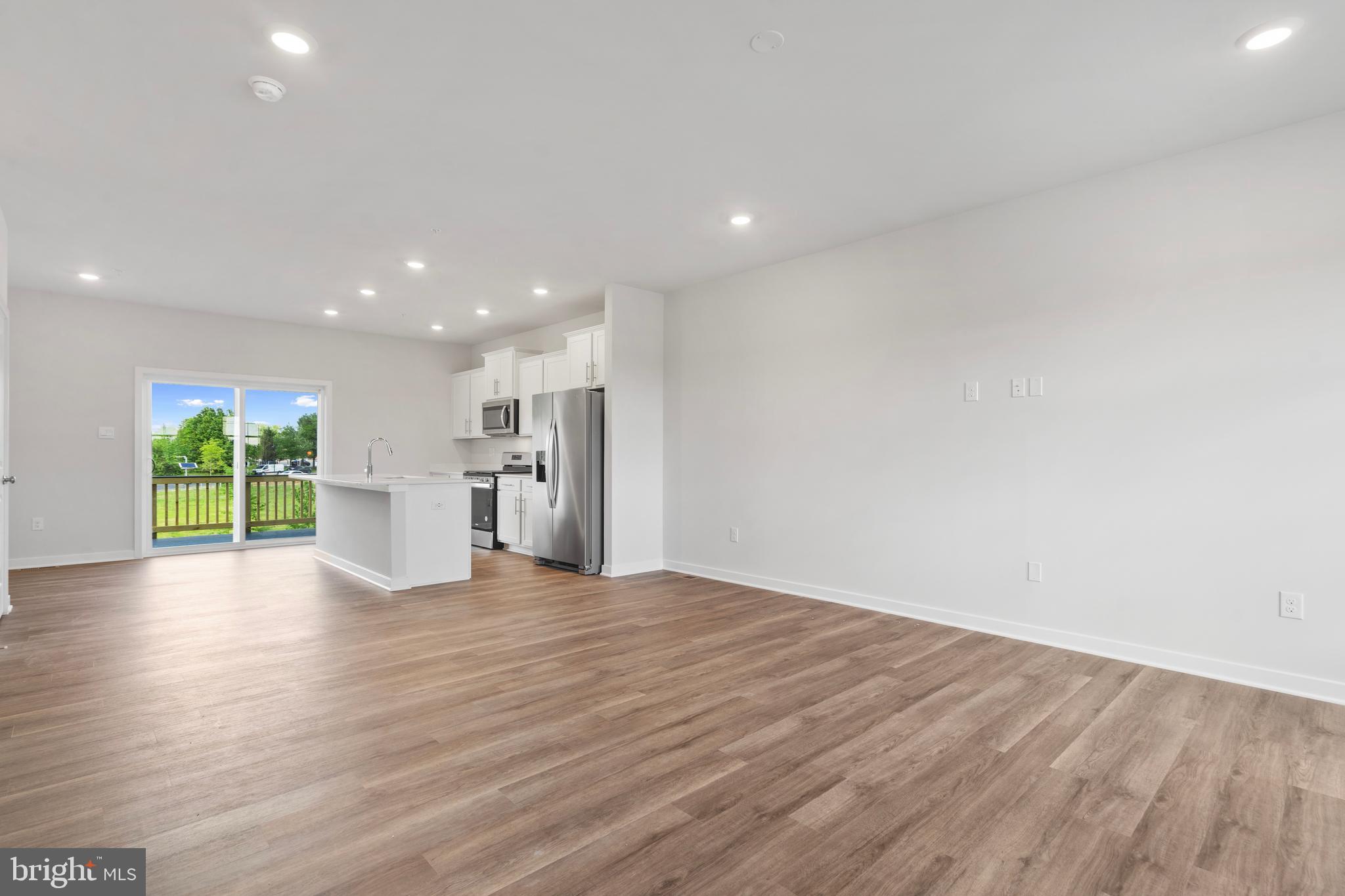 7514 Daybreak Drive Brandywine, MD 20613 - Photo 16 of 29 a view of kitchen with wooden floor and windows