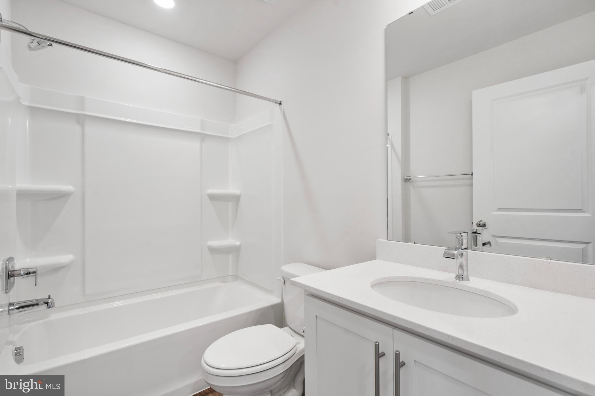 7514 Daybreak Drive Brandywine, MD 20613 - Photo 22 of 29 a bathroom with a sink a toilet and a bathtub