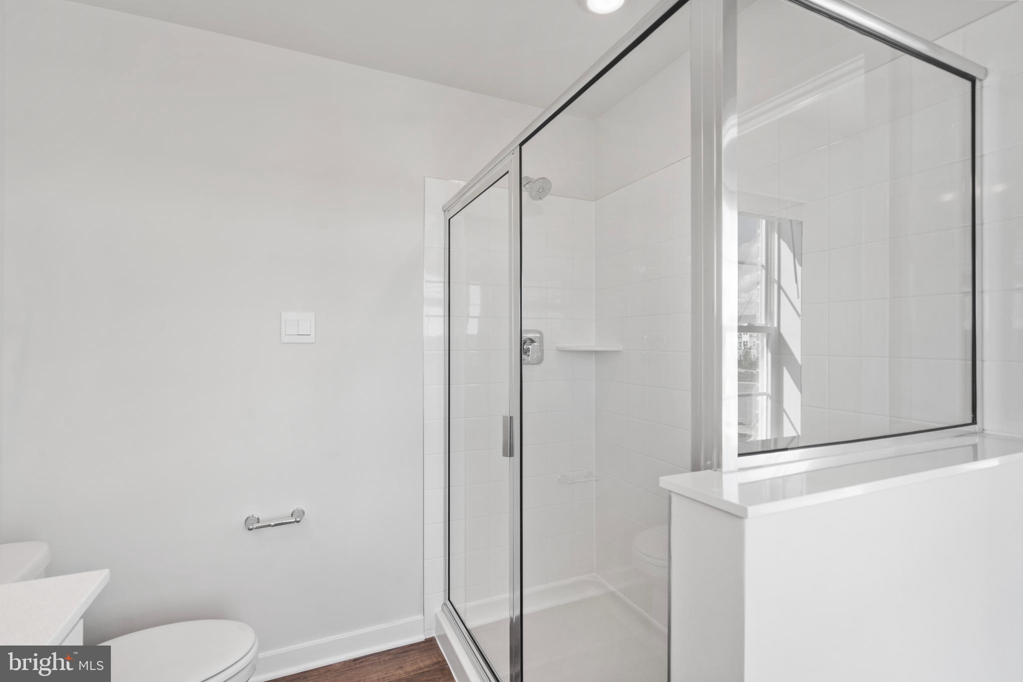 7514 Daybreak Drive Brandywine, MD 20613 - Photo 28 of 29 a bathroom with a shower a toilet and a window