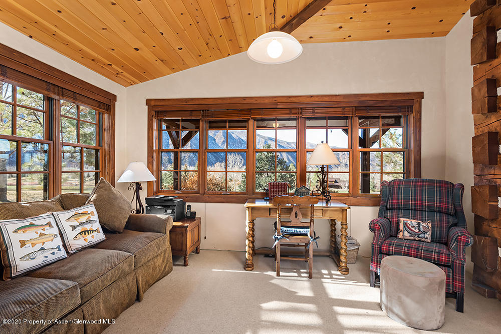 10 Arbaney Ranch Road Basalt, CO 81621 - Photo 10 of 16 a living room with furniture and a large window