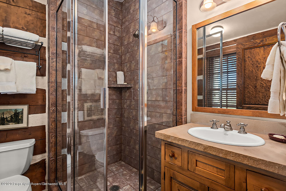 10 Arbaney Ranch Road Basalt, CO 81621 - Photo 12 of 16 a bathroom with a granite countertop sink toilet and shower