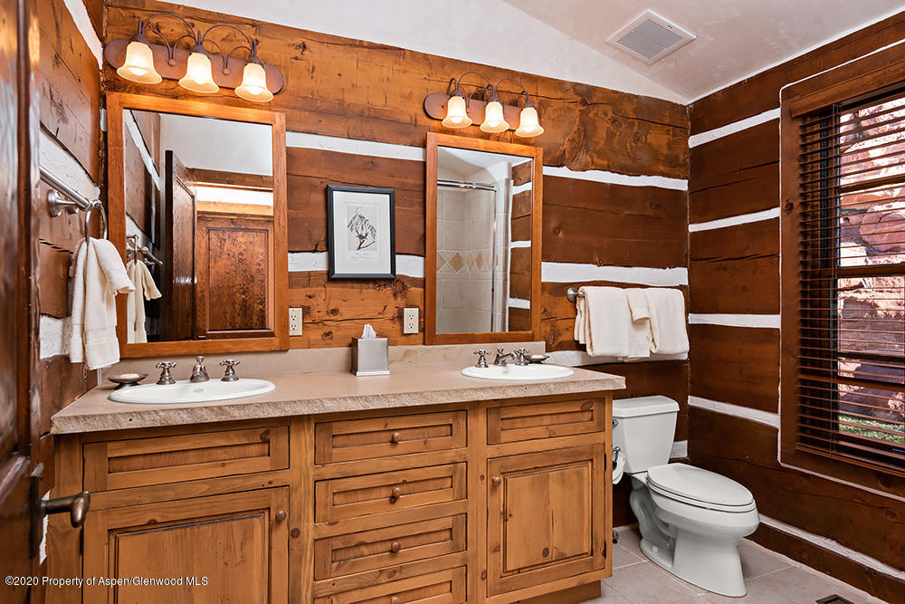 10 Arbaney Ranch Road Basalt, CO 81621 - Photo 14 of 16 a bathroom with a granite countertop toilet sink and mirror