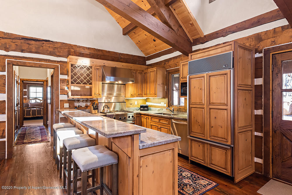 10 Arbaney Ranch Road Basalt, CO 81621 - Photo 5 of 16 a room with stainless steel appliances kitchen island granite countertop furniture and a refrigerator